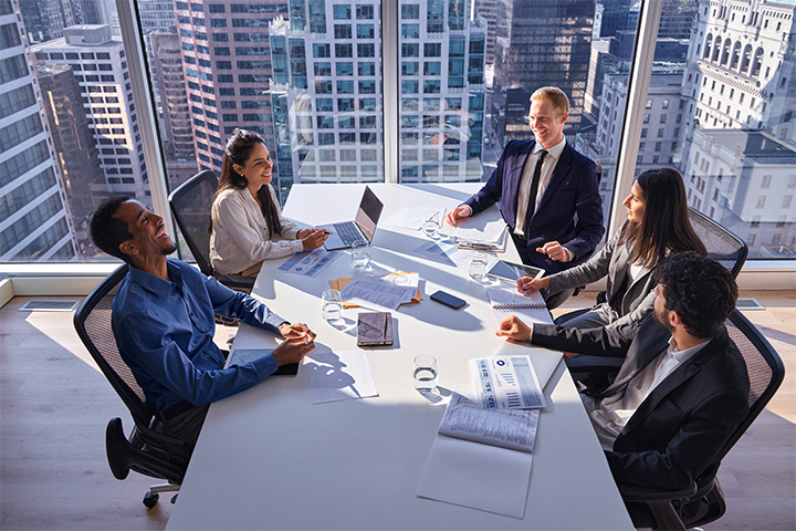 Business team discussing manufacturing financial forecasting