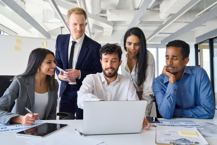 A group of employees comparing cost control strategies.