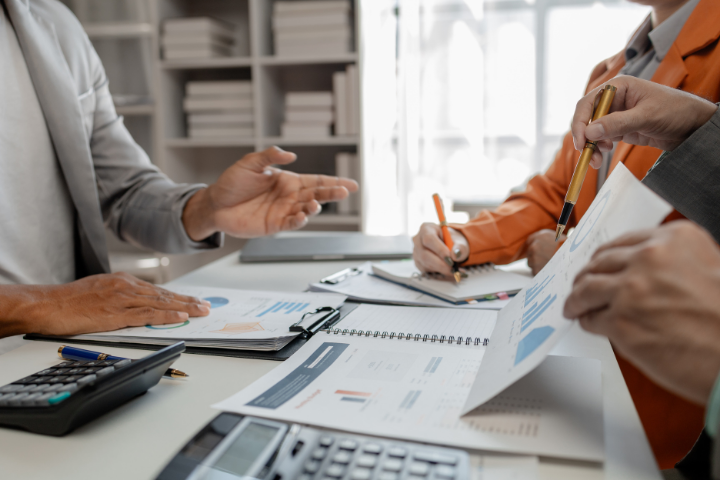 members of an auditing team are discussing the financial auditing process