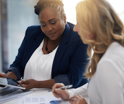 Women discussing manufacturing insurance